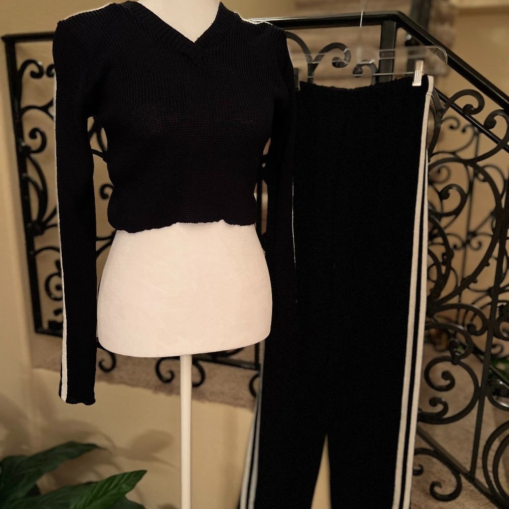 Black crop top w/white stripe on sleeves & matching knit pants. Size large.